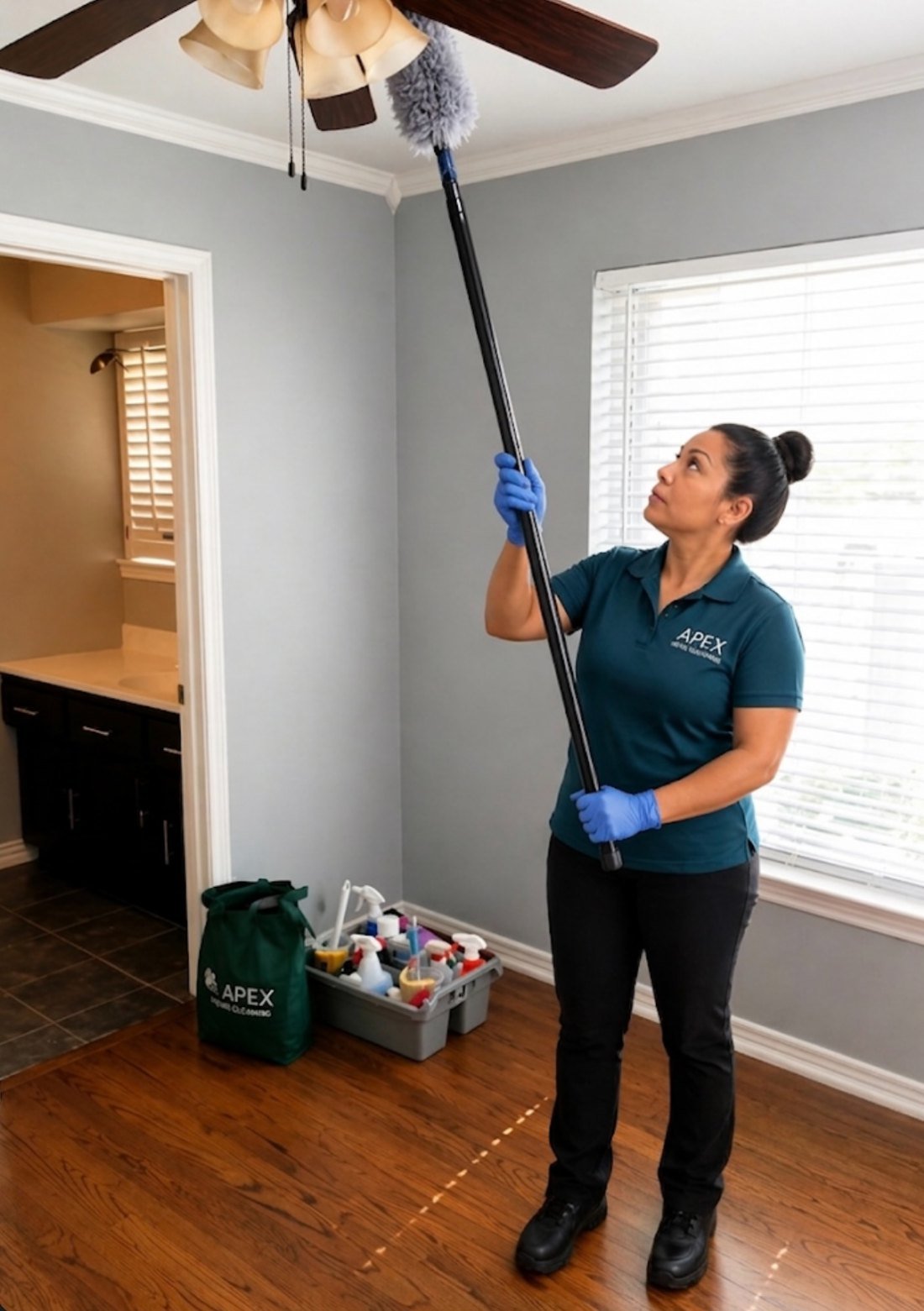 Apex pro dusting a ceiling fan in a Murrieta condo