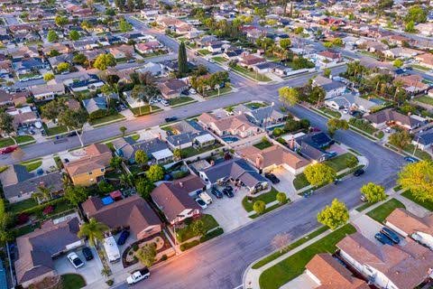 An aerial view of a Corona residential neighborhood with the surrounding hills