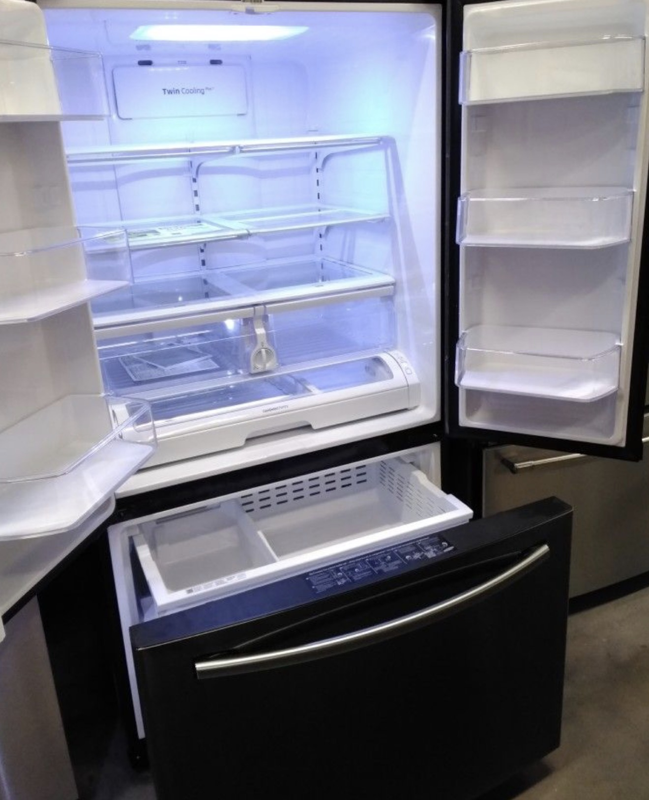 The spotless, empty interior of a refrigerator after an Apex deep clean in a Riverside kitchen