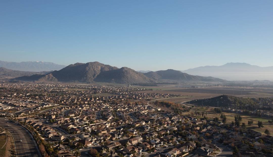 Aerial view of a Hemet neighborhood in the San Jacinto Valley with mountains beyond
