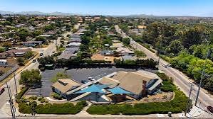 Aerial view of a Fallbrook, California neighborhood surrounded by groves and hills