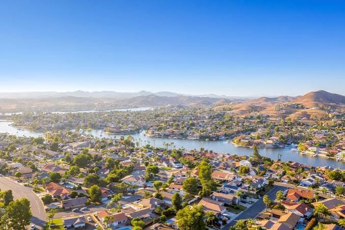 An aerial view of the Canyon Lake community with waterfront homes lining the lake's coves
