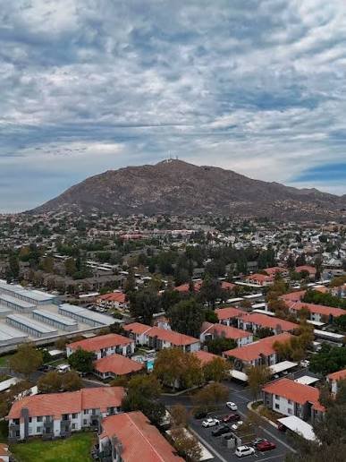An aerial view of Moreno Valley neighborhoods with Box Springs Mountain rising in the background