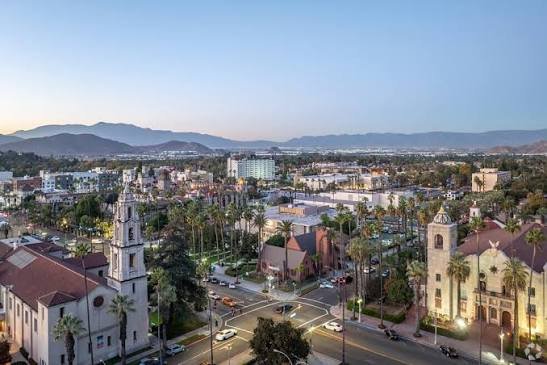 Historic downtown Riverside at dusk with the Mission Inn and church towers