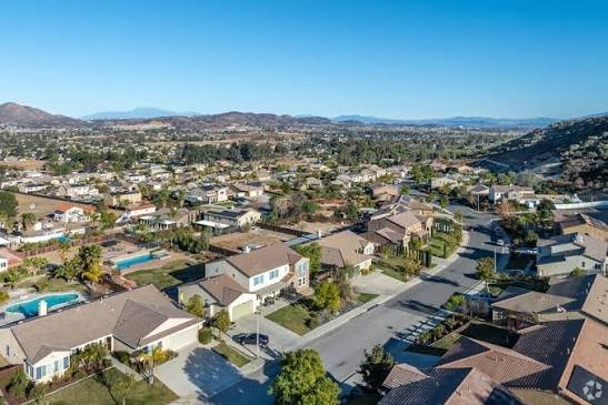 Aerial view of Wildomar neighborhoods with the surrounding hills and mountains beyond