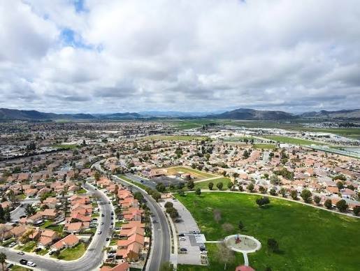 Aerial view of Hemet neighborhoods in the San Jacinto Valley with the surrounding mountains