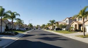 Palm-lined residential street in a Moreno Valley, California neighborhood
