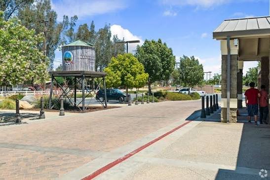 The Wildomar community marker and shaded plaza near a local park